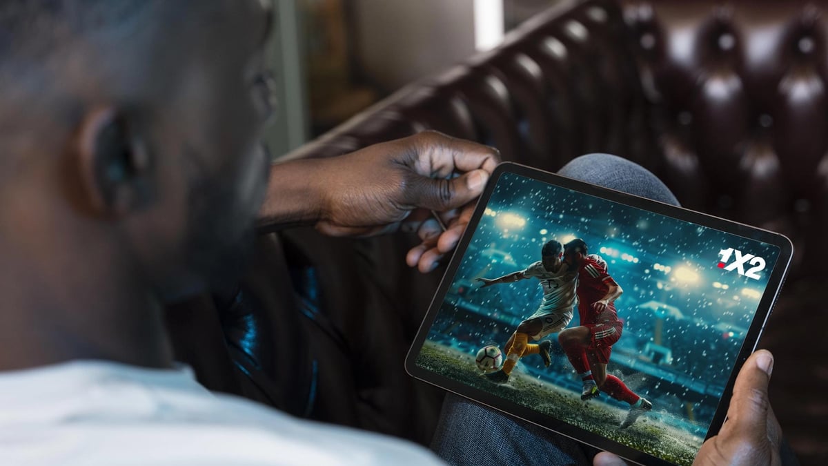 En person streamar fotboll hos 1X2.